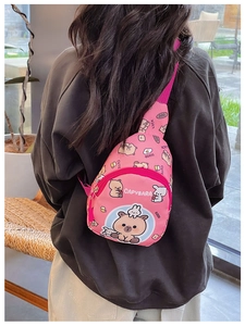 Pink nylon crossbody bag for kids featuring cute capybara patterns and adjustable strap