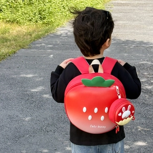 Cute strawberry-shaped kids backpack with 3D leaves and matching mini bunny pouch