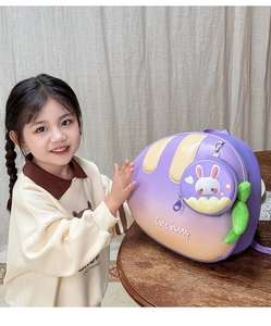 Detail of cute bunny carrot-shaped kids backpack with gradient shell and small round pouch