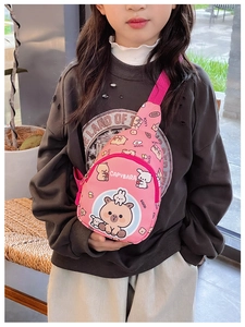 Detailed view of the pink kids crossbody bag featuring cute cartoon capybara prints