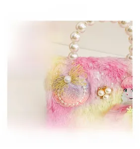 Close-up of plush girl's handbag with gradient fur, pearl handle and cute doll detail