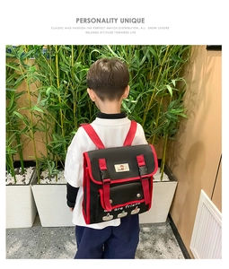 Detail of cute bear embroidery and color-contrast straps on a toddler backpack