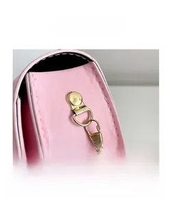 Detail of pink PU leather girls bag with durable gold metal hook and stylish chain strap