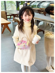 Plush pink girl's handbag with pearl handle and cartoon patch in a cozy winter setting