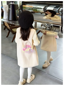 Detail of plush girl purse with pearl handle, lace trim, and golden metal chain strap