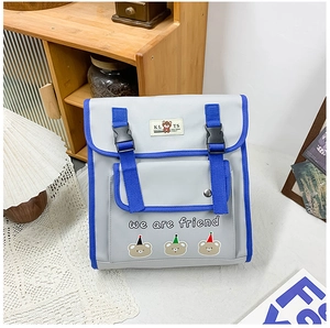 Close-up of cute cartoon bear print and snap buckle on grey canvas kids backpack