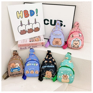 Multiple colorful cartoon capybara chest bags for kids shown in a creative studio setting