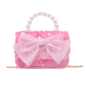 Sac enfant en peluche rose avec noeud en organza, anse perle et motif étoile