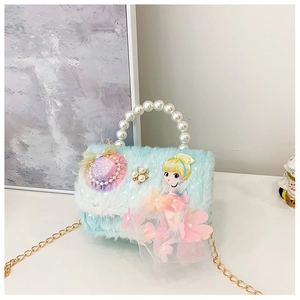 Detailed view of the blue faux fur mini bag with pearl handle and princess embroidery
