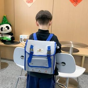 Kids grey and blue backpack with cartoon bears, featuring double buckles and straps