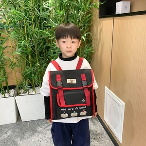 Cute cartoon bear backpack for kids in black and red contrast with adjustable straps