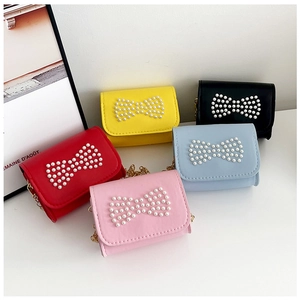 Mini girls' crossbody bags in five colors featuring pearl bow details and metal chains