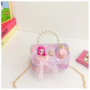 Detail of plush gradient purse with pearl handle and cartoon princess decoration