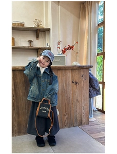 Kids fashion style with blue denim jacket and black mini crossbody bag for autumn