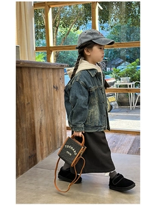 Toddler street style featuring a navy denim jacket and a mini letter crossbody bag