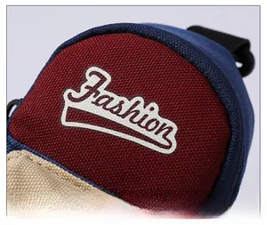 Detailed macro view of the canvas texture and printed Fashion logo on the colorblock bag
