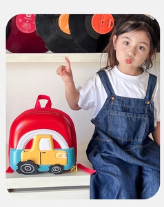 Detailed view of kids 3D hard shell car backpack with colorful patchwork design