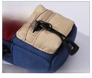 Detailed close-up of a durable canvas neck pouch featuring contrast stitching and zipper