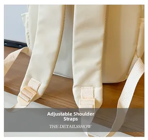 Detail view of adjustable shoulder straps on a creamy white toddler backpack for kids