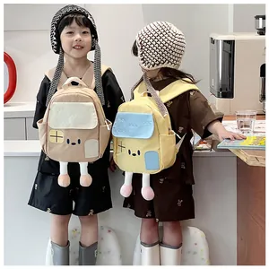 Detailed view of kids cartoon house backpacks featuring playful long plush legs on models