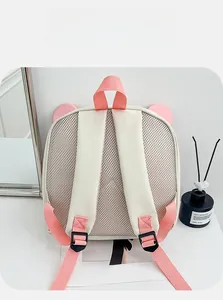 Breathable mesh back and padded pink shoulder straps on a cute cartoon kids backpack