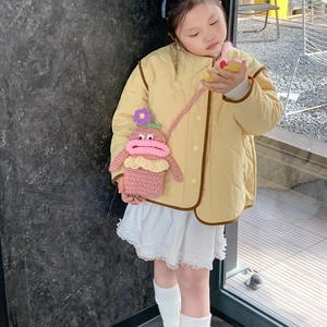 Pink handmade crochet crossbody bag for kids with cute monster face and sausage lips design