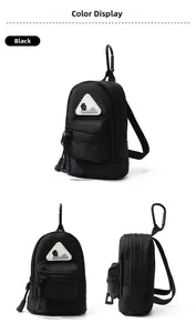Detail view of mini black nylon utility pouch with climbing clip and hiking mountain logo