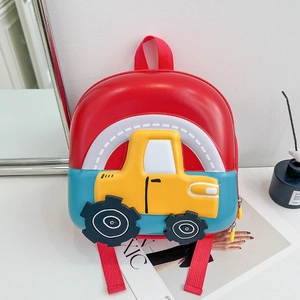 Detail showing the 3D construction vehicle design on a colorful hard shell kids backpack