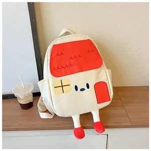 Detail shot of a house-shaped kids backpack featuring a red roof and cute shoe-legs