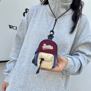 Mini multi-color canvas neck pouch for kids with adjustable strap and fashion logo