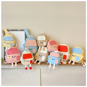 Detailed view of cute cartoon house-shaped backpacks with colorful 3D roof and window designs