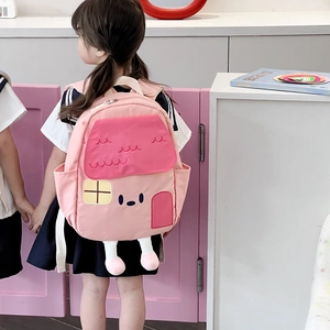 Pink house-shaped cartoon backpack for toddlers with cute 3D legs and plush details