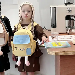 Cute cartoon house shaped yellow kids backpack with small decorative legs for toddlers