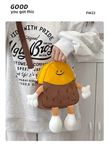 Detail of cute cartoon doll crossbody bag with adjustable strap and zip closure