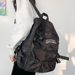 Zaino da scuola nero in nylon con fiocco carino e tasche multiple con cerniera