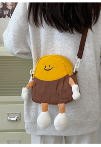 Detailed view of a cute cartoon crossbody bag styled as a character with 3D legs