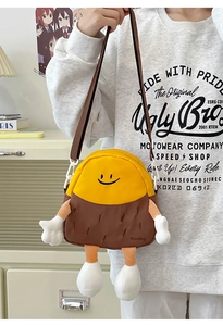 Detailed view of creative cartoon crossbody bag with 3D limbs and adjustable strap