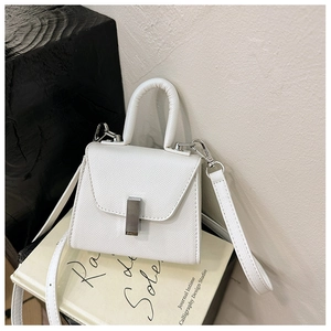 Detail shot of mini white crossbody bag with cross-grain leather texture and metal lock