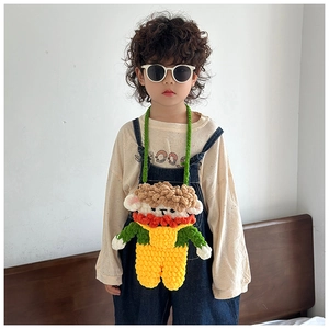 Detail of a handmade crochet cartoon crossbody bag for kids with 3D woven texture