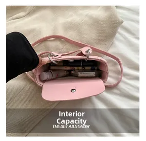 Internal capacity of pink quilted crossbody bag for kids showing makeup storage detail