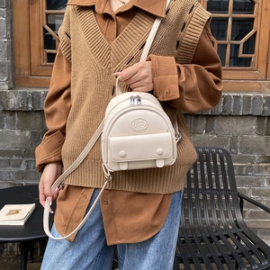 Chic cream white mini PU leather backpack for women with adjustable straps and front pocket