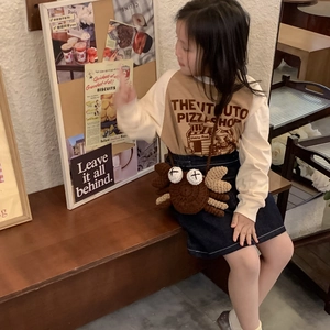 Cute brown hand-knitted crab shoulder bag for children with unique claw and eye details