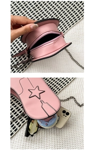 Pink boot-shaped crossbody bag showing internal capacity for phone and accessories