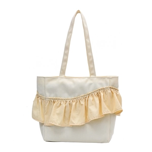 Minimalist canvas tote bag in off-white with pale yellow pleated ruffle design details