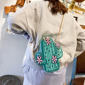 Creative cactus shaped crossbody bag in green with pink flowers and gold chain strap