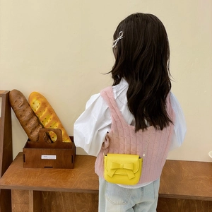 Mini yellow crossbody bag for girls with cute bow decoration and gold chain strap