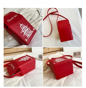 Detailed views of red takeout box crossbody bag featuring Thank You art and tower icon