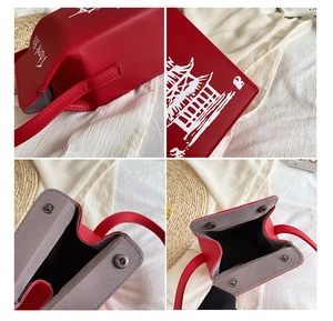 Macro detail of the red PU leather bag featuring white pagoda prints and magnetic closure