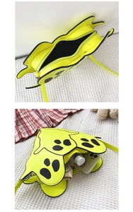 Interior view of yellow ghost crossbody bag showing storage for phone and wallet