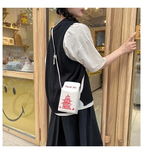 Creative white takeaway box shaped crossbody bag with red Thank You text and tower graphic